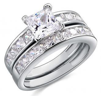 Zásnubní prsten z bílého zlata zdobený diamanty a větším bílým diamantem